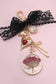 BAG CHARM-DRIED FLOWER BOW HEART RHINESTONE | 80K037