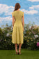 SMOCKED TIERED MIDI DRESS